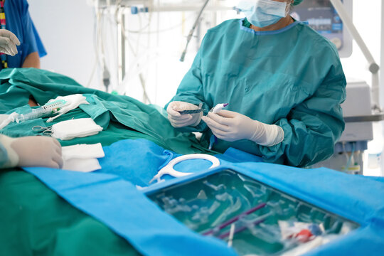 Doctor preparing tracheotomy procedure in ICU emergency ward