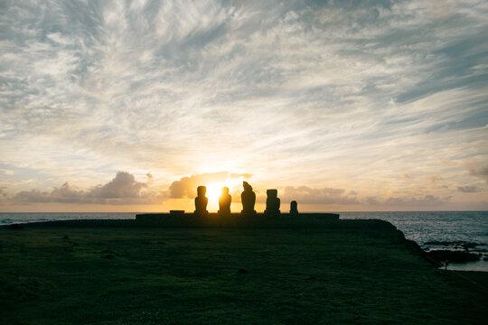 Moai silhouettes at sunrise on Easter Island
