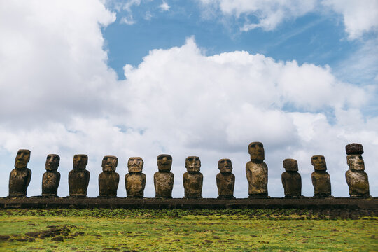 Moai statues on Easter Island under a cloudy sky