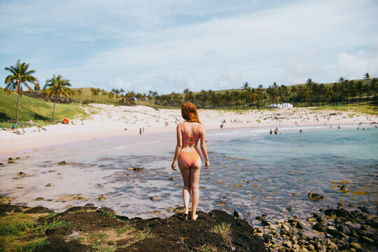 Scenic beach on Easter Island with visitors enjoying sunny day