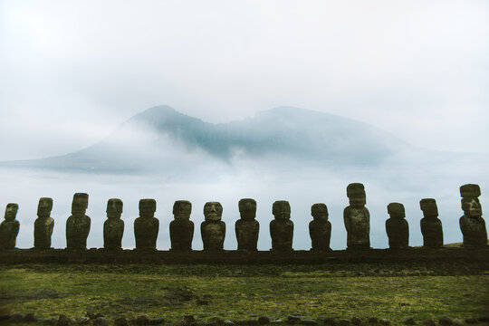 Moai statues on Easter Island with misty background