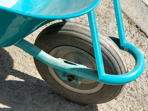 Blue wheelbarrow on a construction site