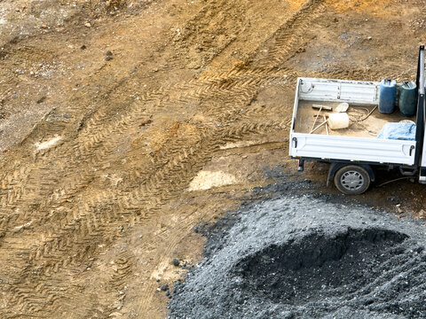 Construction truck and materials at building site