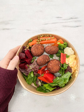 Vegan buddha bowl with falafel, hummus and mixed vegetables