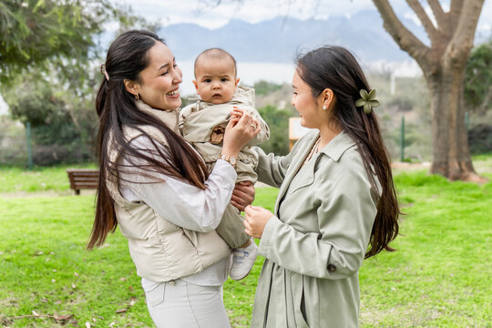 Family enjoying quality time outdoors in park setting