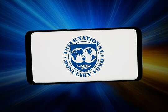 Stuttgart, Germany - 05-18-2026: In this photo illustration, the logo of institution International Monetary Fund (IMF) is displayed on a smartphone in front of abstract background on computer screen.
