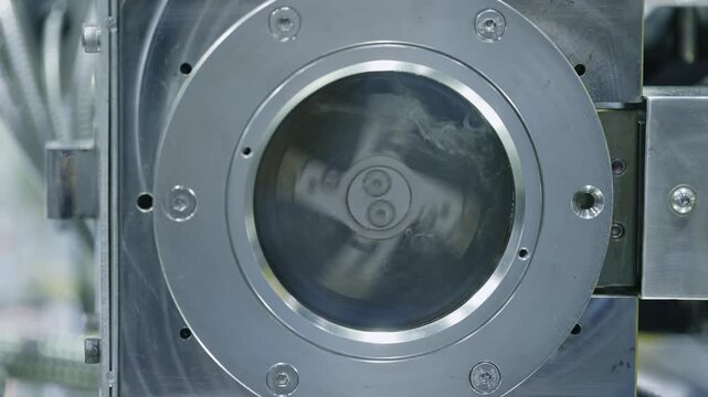 Close up of high speed industrial centrifuge system operating in advanced research facility. Automated processing equipment used for laboratory analysis and precision manufacturing.