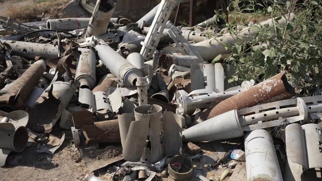 Empty shells from rockets and artillery shells of various calibers. Concept of military conflict.