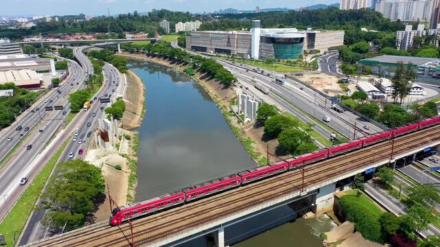 SAO PAULO, BRAZIL - MAY 2026: Aerial view of the Marginal Pinheiros highway with river reflection.