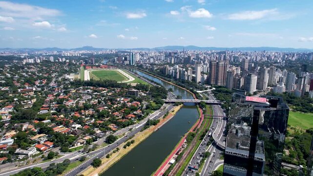 SAO PAULO, BRAZIL - MAY 2026: Aerial view of the Marginal Pinheiros highway with river reflection