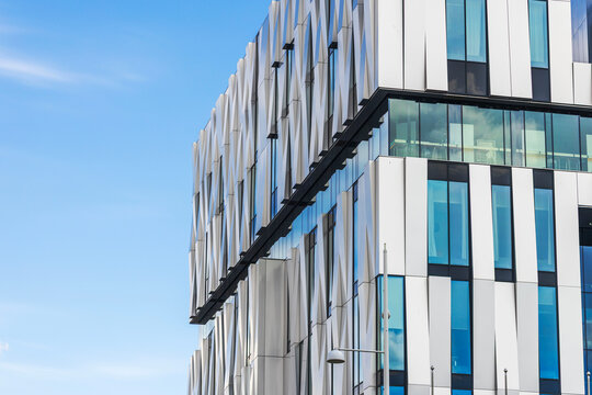 Close-up view of Uppsala Concert and Congress building facade with modern glass windows. Sweden.