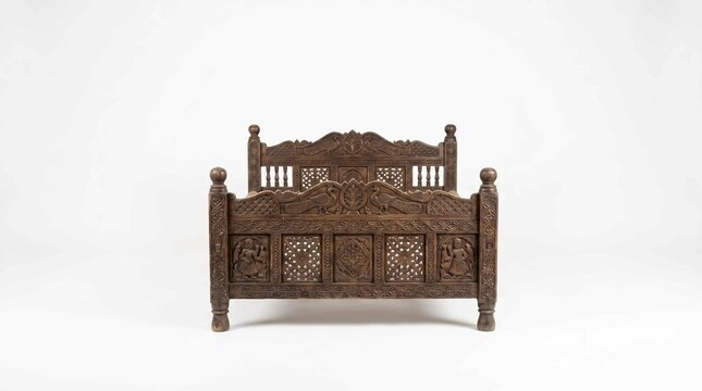 Ornate traditional wooden bed frame featuring detailed hand carved patterns and intricate cultural artistic motifs