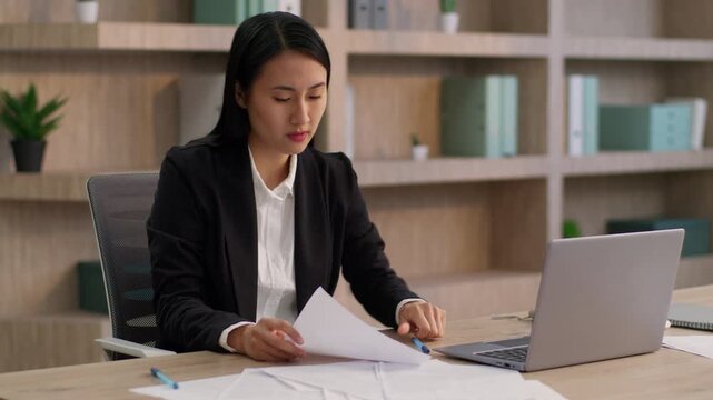 Upset Chinese Asian business woman crumple paper sheet throwing bad report plan female girl businesswoman ethnic Korean angry office worker manager write project document frustration lack idea indoor