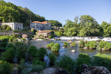 Fototapeta premium Ponte maceira village, tambre river cascade, camino de santiago