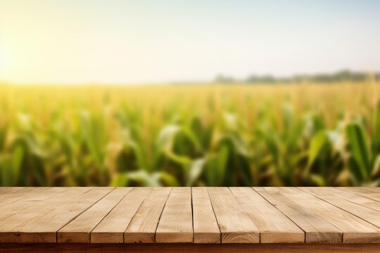 Empty wooden surface presenting products with a blurred corn field background