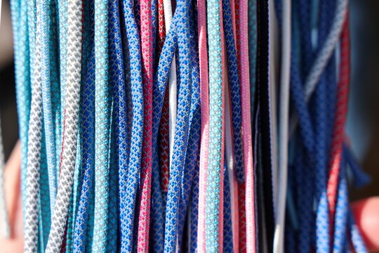 Colorful paracord ropes creating a textured pattern background