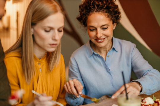 Friends enjoying brunch together at a cafe restaurant