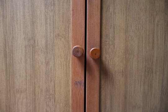 Wooden cabinet doors with round knobs