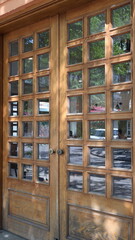 Obraz premium Wooden door with many small glass panes