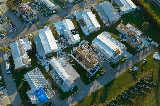 Badly damaged mobile homes after hurricane Ian in Florida residential area. Consequences of natural disaster