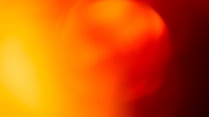 Fiery bokeh background with glowing yellow orange and deep red defocused light circles for dramatic backdrop