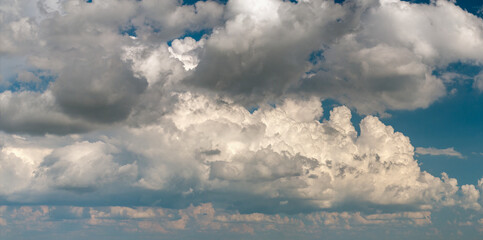Fototapeta premium Blue sky with white clouds. Bright summer skyscape