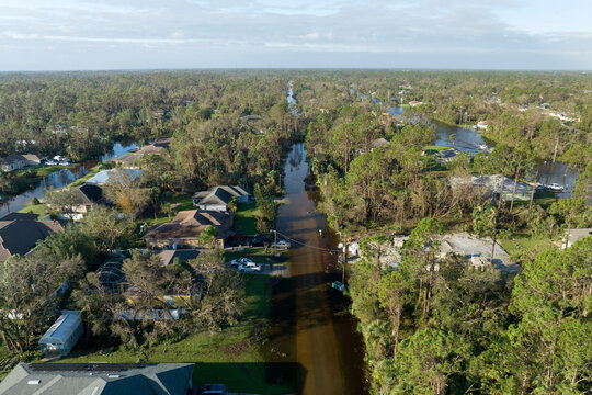 Aftermath of natural disaster. Flooded houses by hurricane rainfall in Florida residential area