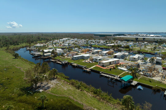 Badly damaged mobile homes after hurricane Ian in Florida Southwest region residential area. Consequences of natural disaster