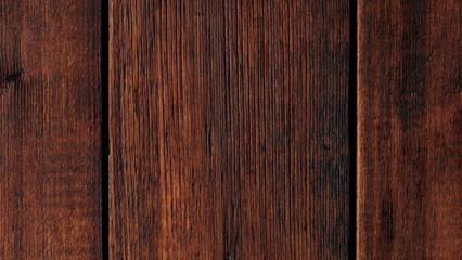 Obraz premium Dark brown wood texture background with natural grain pattern and vertical plank detail