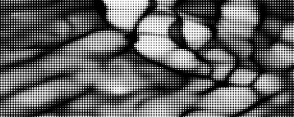 Fototapeta premium The halftone texture is monochrome. A wave of dots. Abstract black and white texture. Ink dots randomly placed on a white background. Pop art texture for printing on wrapping paper, business cards