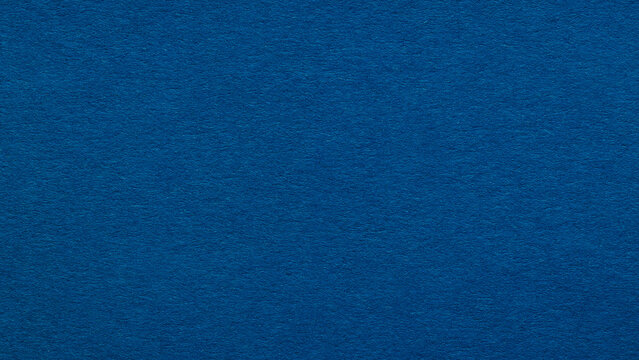 Dark blue paper texture with subtle fibers as a deep navy background for design and creative projects