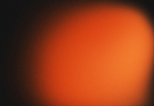 Abstract fiery orange glow gradient background with dark vignette and star-like texture