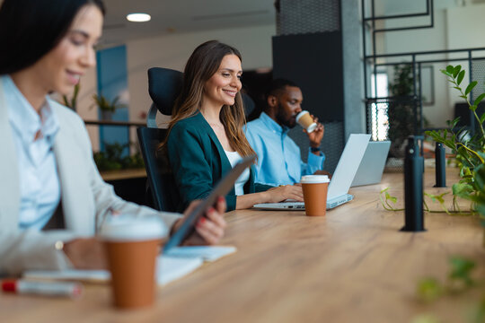Diverse business professionals working together in modern office