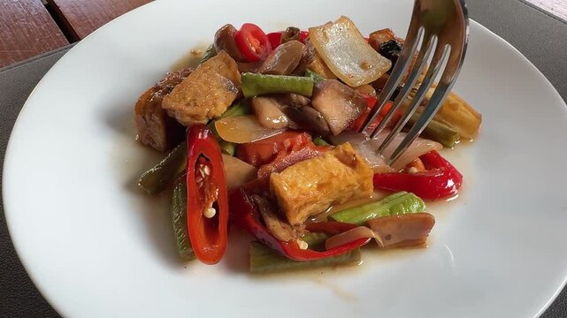 Eating Spicy Thai Chili Tofu Stir Fry