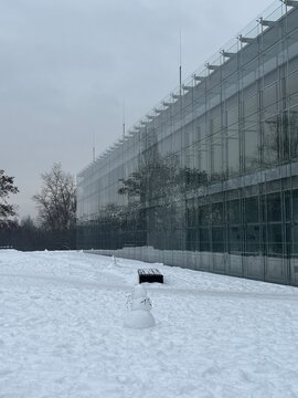 Modern glass facade of Charles University Faculty of Humanities in Prague