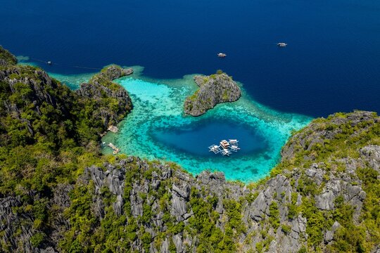 Aerial view of spectacular Green Lagoon with limestone cliffs Coron