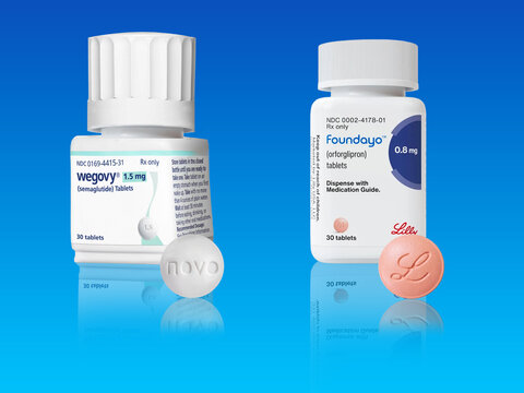 Studio shot of bottle of Wegovy weight loss drug  with pill from Novo Nordisk and Foundayo from Eli Lilly on blue background with copy space. Copenhagen, Denmark - May 18, 2026.