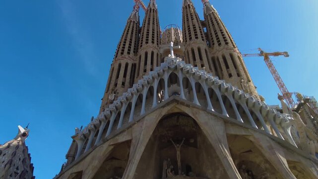 Street view around the downtown and the cathedral sagrada familia of the capitol city Barcelona, on a sunny spring day. With view from top of a bus