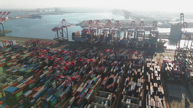 Drone view of stacked containers and rail corridors at Long Beach port