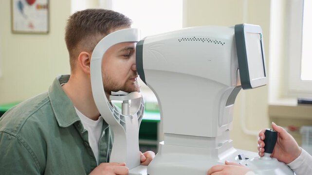 Optometrist checking patient's intraocular pressure with tonometer
