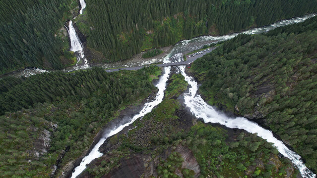 Aerial View of L&aring;tefossen Waterfall and Forest River Crossing in Odda Norway