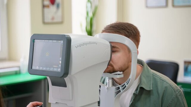 Patient undergoing eye examination with autorefractor keratometer
