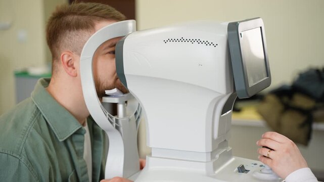 Ophthalmologist checking patient's vision with an autorefractor