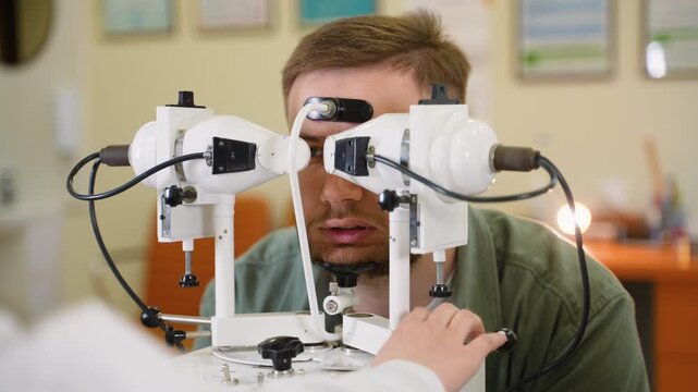 Ophthalmologist checking patient's vision with synoptophore
