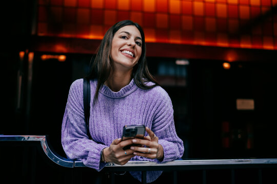 Young woman looking up with smile while working on tablet with electronic pen. Ambition, career goals, and digital transformation. Female expert using modern software for business task, remote life.