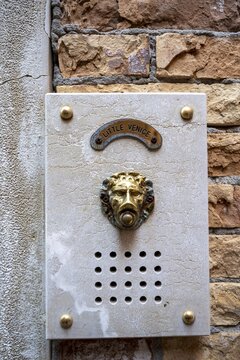 Bell in the shape of a lion on a house wall, Venice, Veneto, Italy