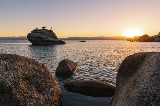 Bonsai Rock, small tree on a rock in the water, sunset, Lake Tahoe, California, USA