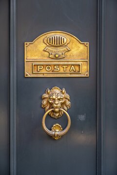 Door knocker in the shape of a lion and letter slot, Venice, Veneto, Italy