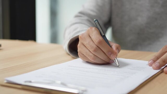 Signing Residential Lease Agreement, Real Estate Contract, Or Legal Document For Property Rental Or Business Deal, Hand, Pen, Paper, Table, Desk