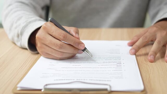 Signing Residential Lease Agreement, Real Estate Contract, Or Legal Document For Property Rental Or Business Deal, Hand, Pen, Paper, Table, Desk